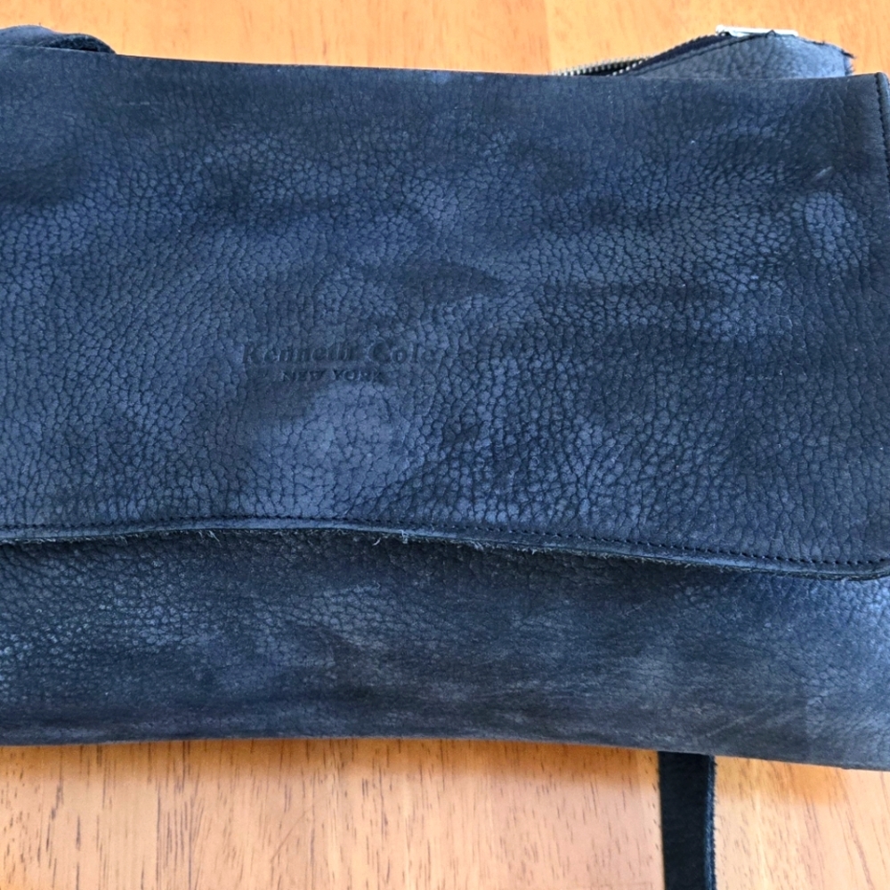 Black Cowhide messenger bag.